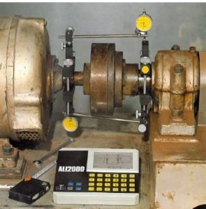Figure 1. The PRUFTECHNIK ALI2000 Dial alignment tool circa 1982 versus the PRUFTECHNIK OPTALIGN laser alignment tool introduced in 1984. 