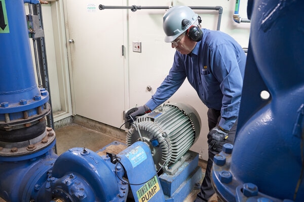 a wireless vibration sensor installed for condition monitoring on a water pump in a facility