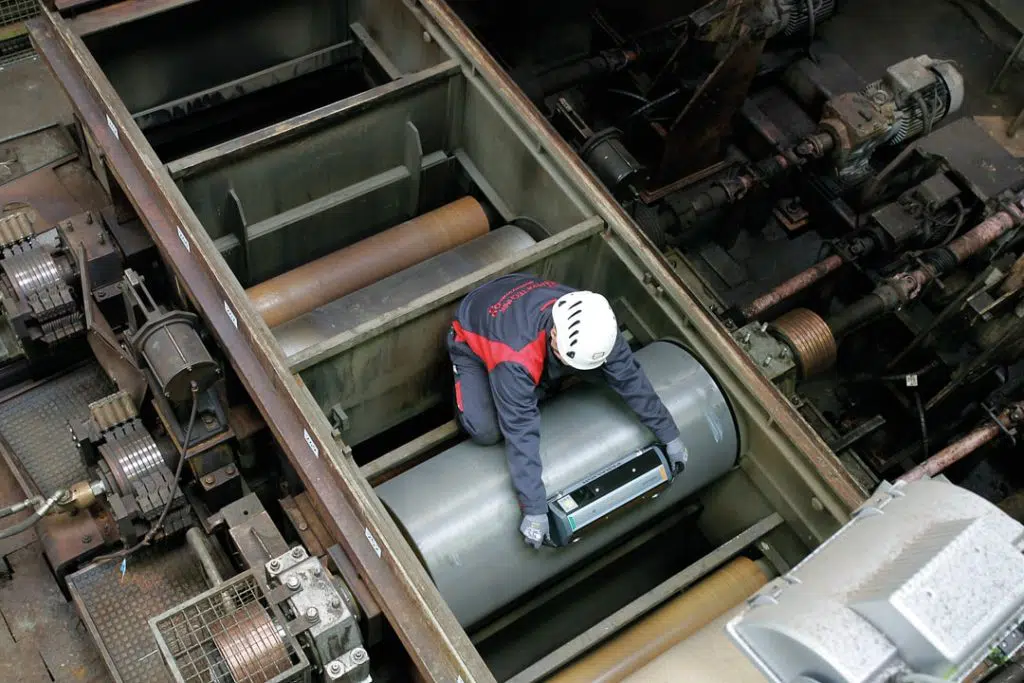 technician performing roller alignment part of PeakRGA service