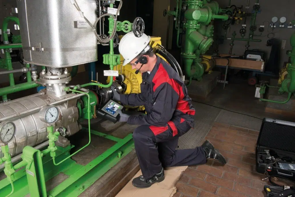 Maintenance worker gathering data from alignment check